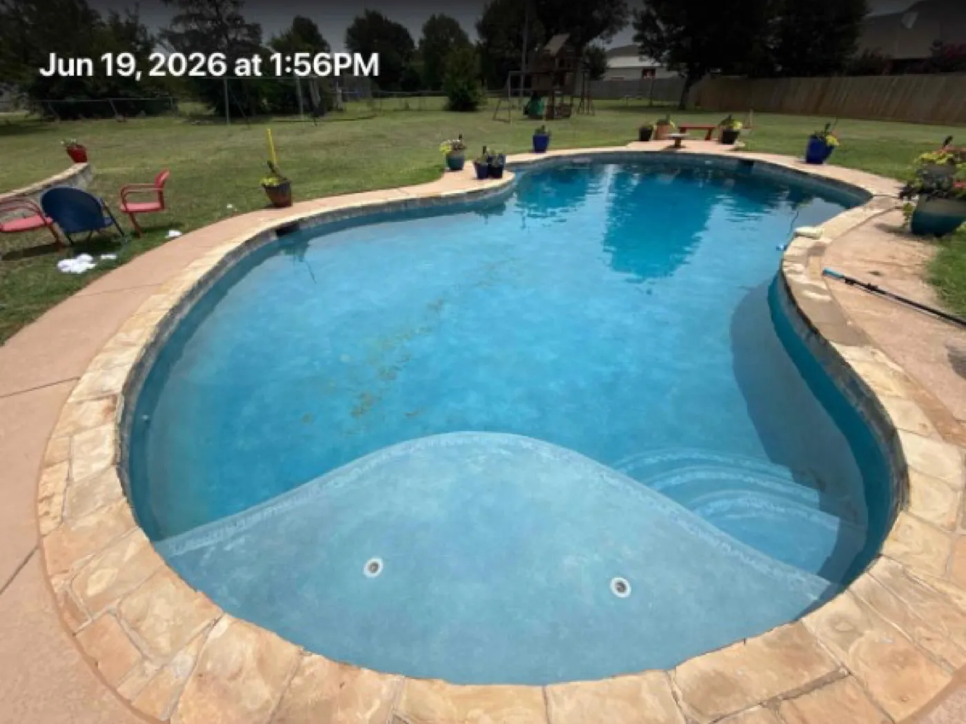 Clean, clear pool kept swim-ready while owners are away in the OKC metro